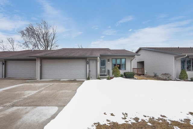 ranch-style house with driveway and an attached garage