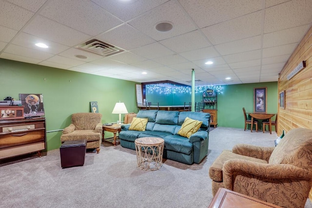 carpeted living room with visible vents and recessed lighting