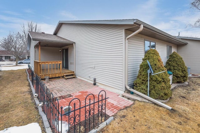 view of property exterior with a patio