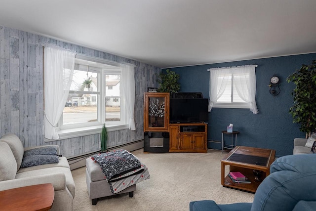 carpeted living area featuring a baseboard heating unit