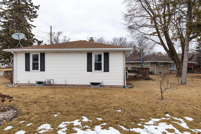 exterior space featuring a yard and a chimney