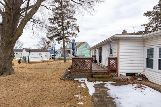 view of yard featuring fence and a deck