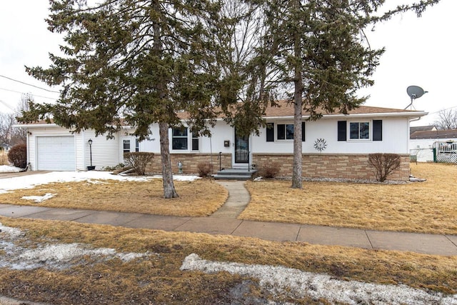 ranch-style house featuring an attached garage, driveway, and fence