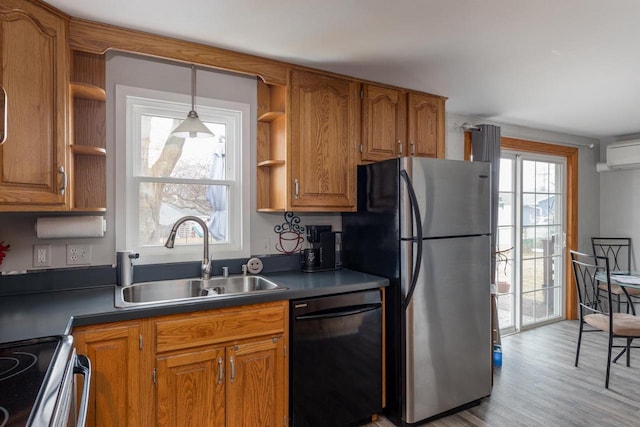 kitchen with open shelves, brown cabinetry, freestanding refrigerator, a sink, and dishwasher