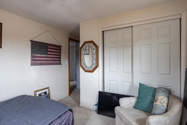 bedroom featuring carpet floors, a closet, and baseboards