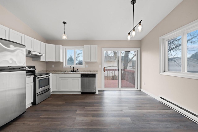 kitchen featuring stainless steel appliances, baseboard heating, vaulted ceiling, a sink, and under cabinet range hood