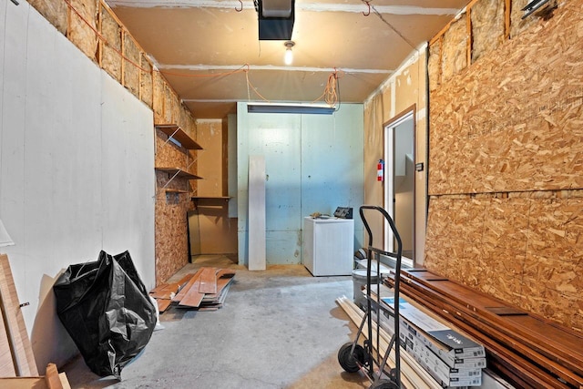 interior space featuring concrete flooring and refrigerator