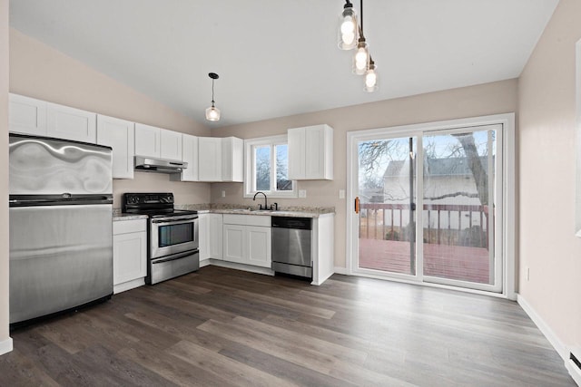 kitchen featuring lofted ceiling, under cabinet range hood, stainless steel appliances, dark wood-type flooring, and white cabinets