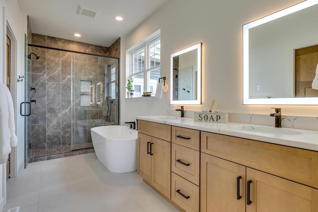 full bathroom featuring visible vents, a sink, and a shower stall