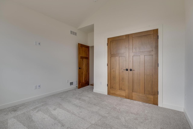 unfurnished bedroom featuring carpet floors, baseboards, and visible vents