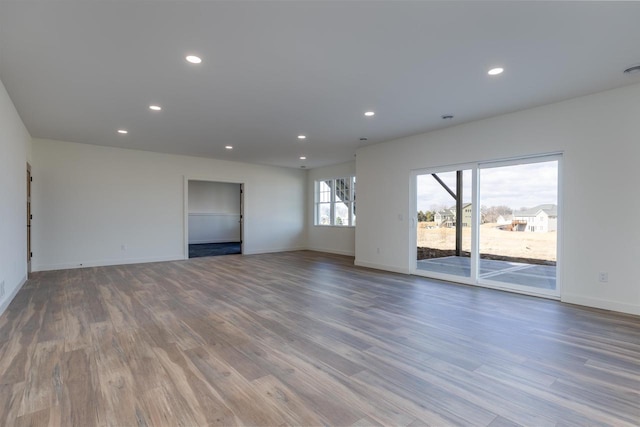 spare room with recessed lighting and wood finished floors