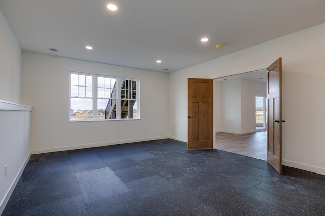 unfurnished room featuring a wealth of natural light, recessed lighting, and baseboards