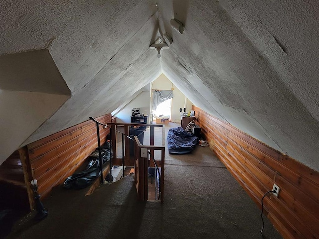 attic featuring an upstairs landing