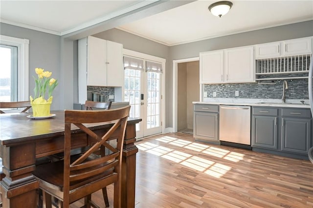 kitchen featuring a sink, white cabinetry, gray cabinets, and stainless steel dishwasher