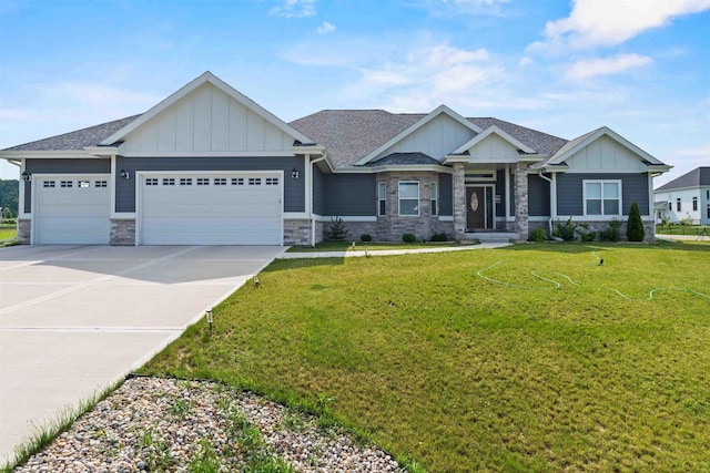 craftsman-style house featuring board and batten siding, an attached garage, driveway, and a front yard