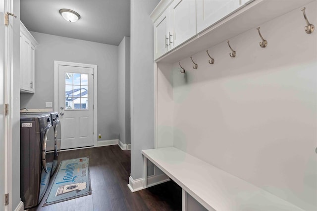 mudroom with washing machine and clothes dryer, dark wood finished floors, and baseboards