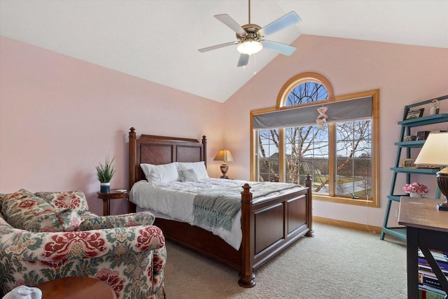 bedroom with a ceiling fan, light carpet, vaulted ceiling, and baseboards