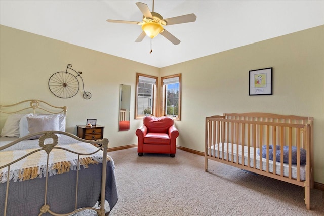 bedroom with carpet floors, ceiling fan, and baseboards