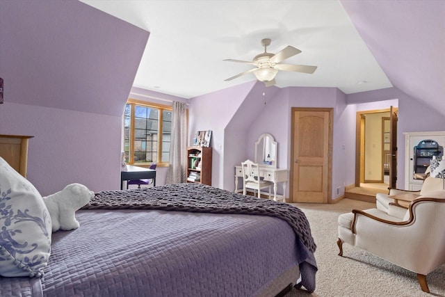 carpeted bedroom with ceiling fan, baseboards, and vaulted ceiling