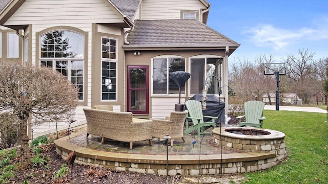 view of patio / terrace with a fire pit