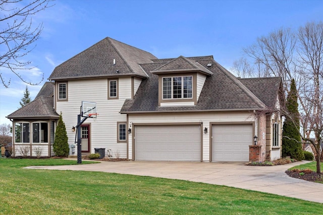 view of front of property featuring driveway, an attached garage, a front lawn, and roof with shingles