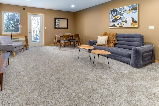 living area with recessed lighting, carpet flooring, and baseboards