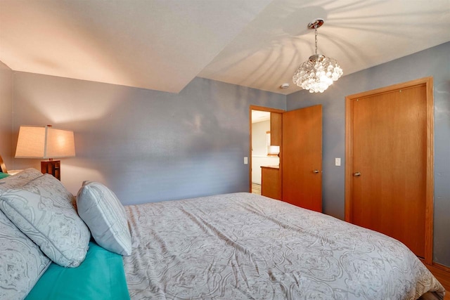 bedroom featuring a notable chandelier