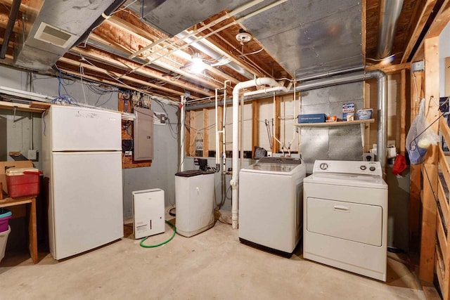 laundry area featuring visible vents, laundry area, independent washer and dryer, and electric panel