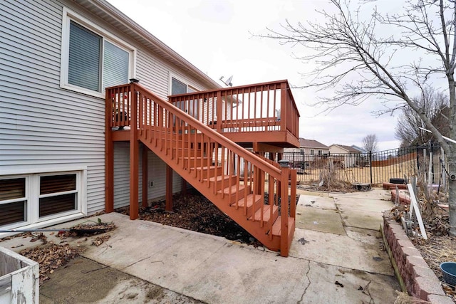 exterior space with stairway, a patio area, and fence