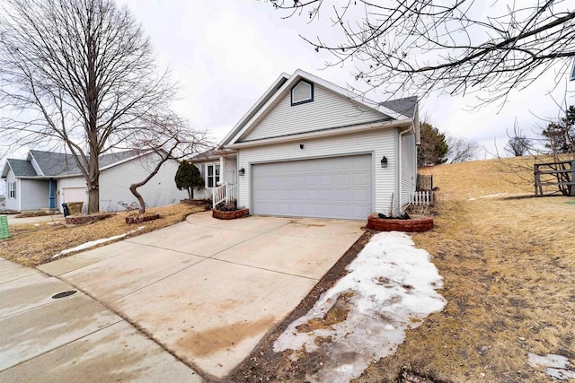 view of front of property with driveway and a garage