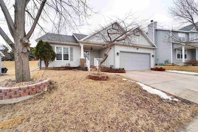 view of front of property featuring covered porch, driveway, and an attached garage