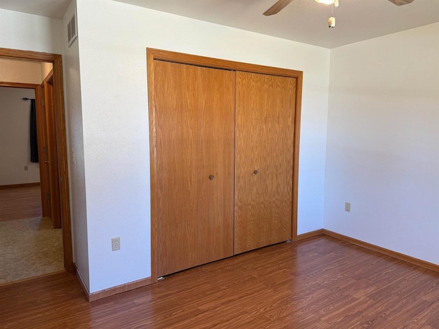 1080 Jaystone Ter, Waterloo, WI 53594 - unfurnished bedroom with baseboards, a closet, and wood finished floors