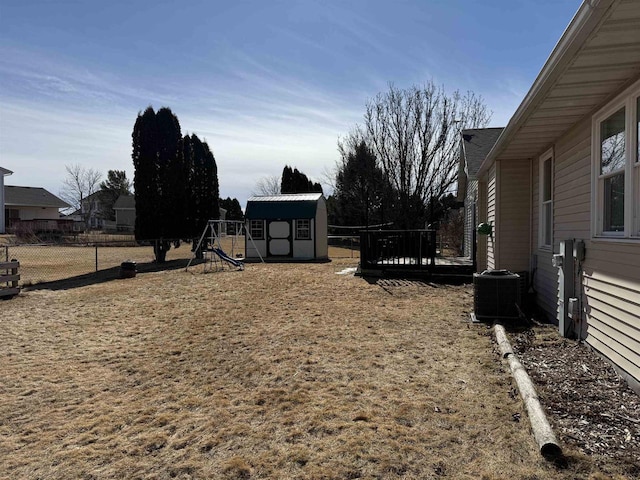 1080 Jaystone Ter, Waterloo, WI 53594 - view of yard featuring an outbuilding, fence, central AC, a playground, and a storage unit