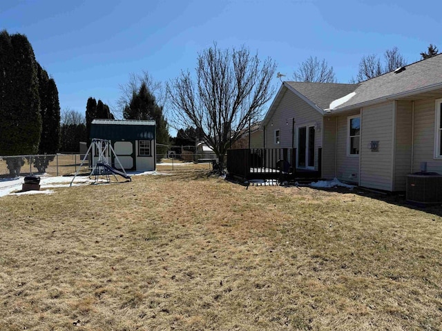 1080 Jaystone Ter, Waterloo, WI 53594 - view of yard featuring central AC, a fenced backyard, a shed, and an outdoor structure