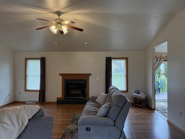 1080 Jaystone Ter, Waterloo, WI 53594 - living room featuring vaulted ceiling, ceiling fan, wood finished floors, a fireplace, and baseboards