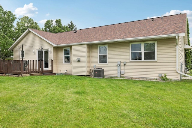 1080 Jaystone Ter, Waterloo, WI 53594 - rear view of property with central air condition unit, a deck, a shingled roof, and a lawn