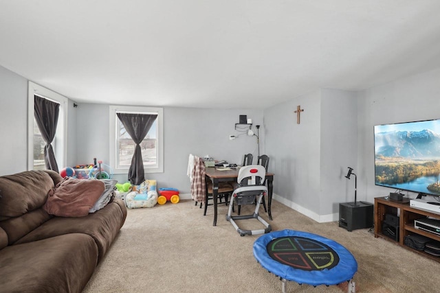 living room with carpet floors and baseboards