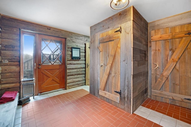 entrance foyer with brick floor and wooden walls