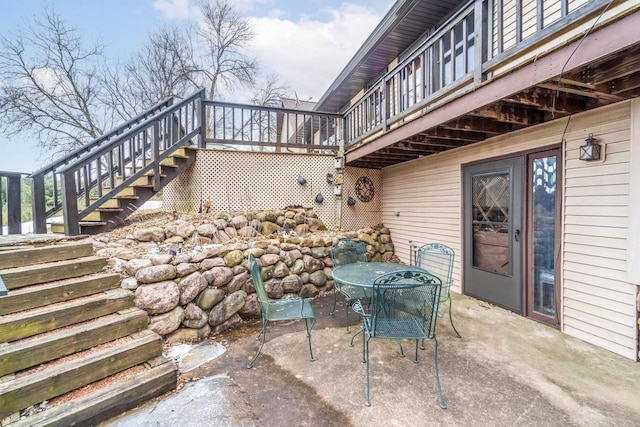 view of patio / terrace featuring stairs and outdoor dining space