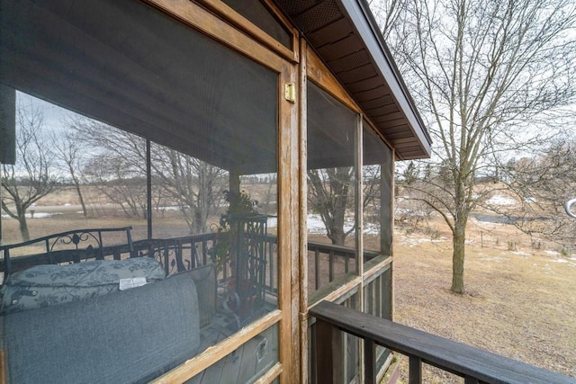 wooden deck featuring a sunroom