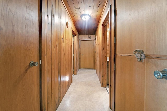 hall featuring wooden walls