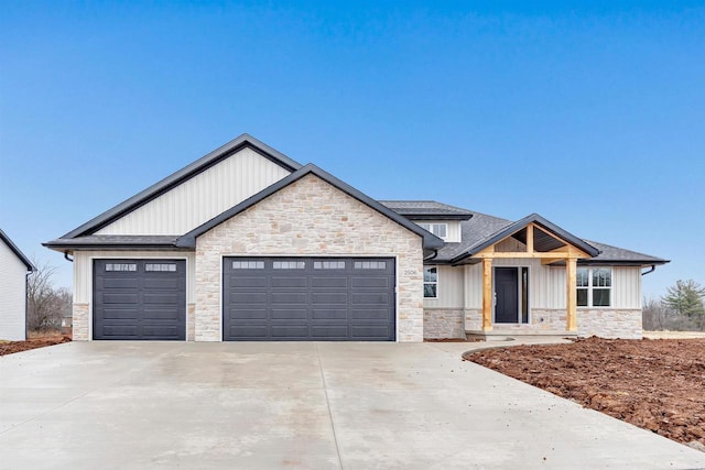 craftsman inspired home with a garage, roof with shingles, driveway, and board and batten siding