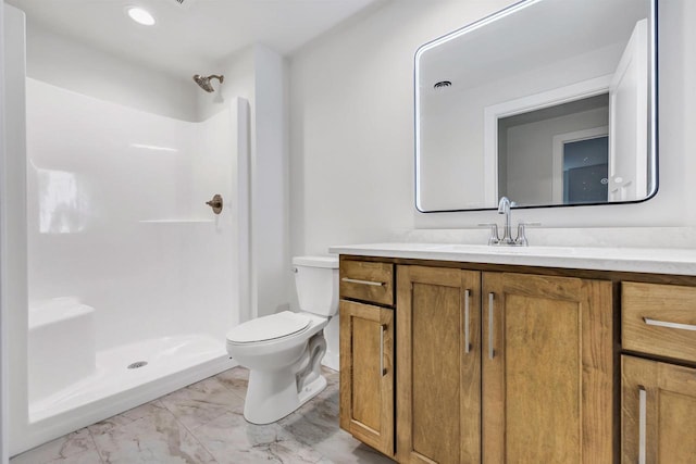 full bathroom featuring toilet, marble finish floor, a shower stall, and vanity