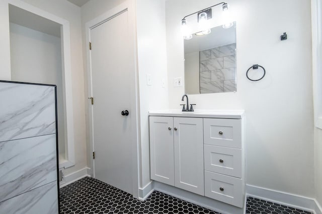 bathroom featuring baseboards, visible vents, and vanity