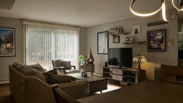 living room with baseboard heating and wood finished floors