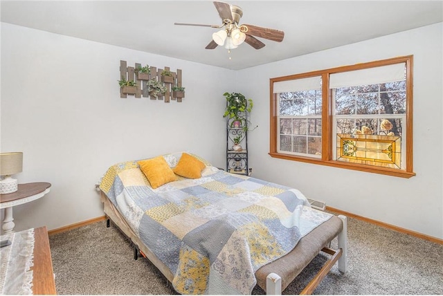 bedroom featuring carpet flooring, a ceiling fan, and baseboards