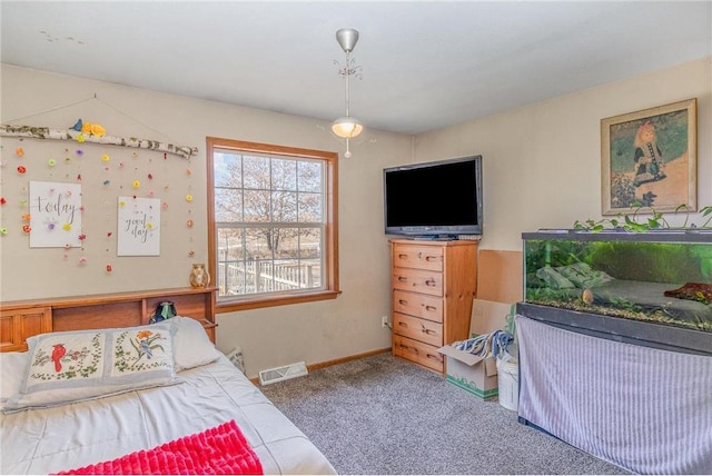 carpeted bedroom with visible vents and baseboards