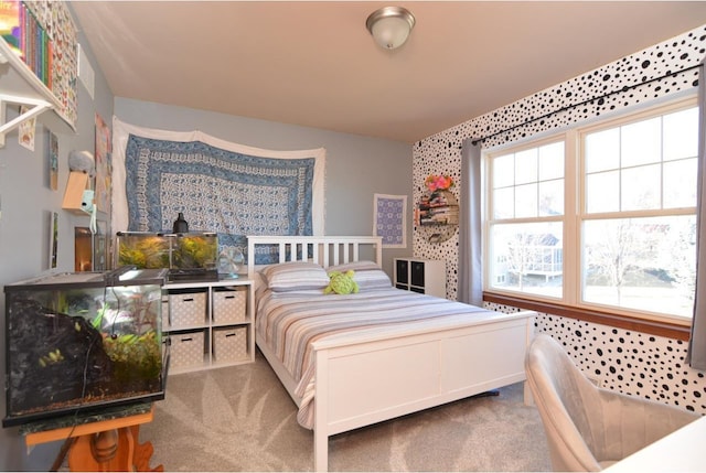 carpeted bedroom featuring multiple windows