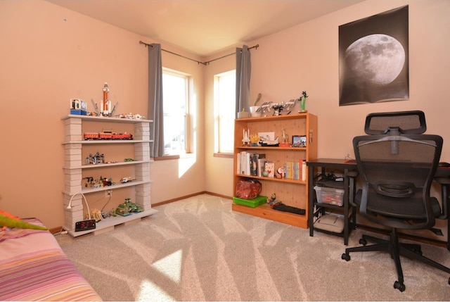 carpeted office with baseboards