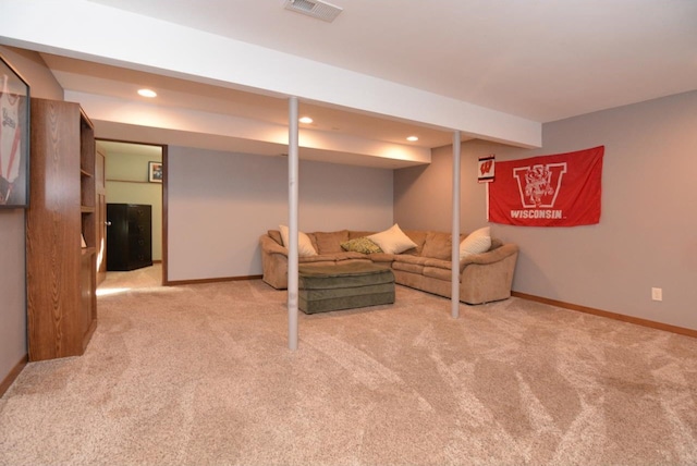 interior space with recessed lighting, light carpet, visible vents, and baseboards